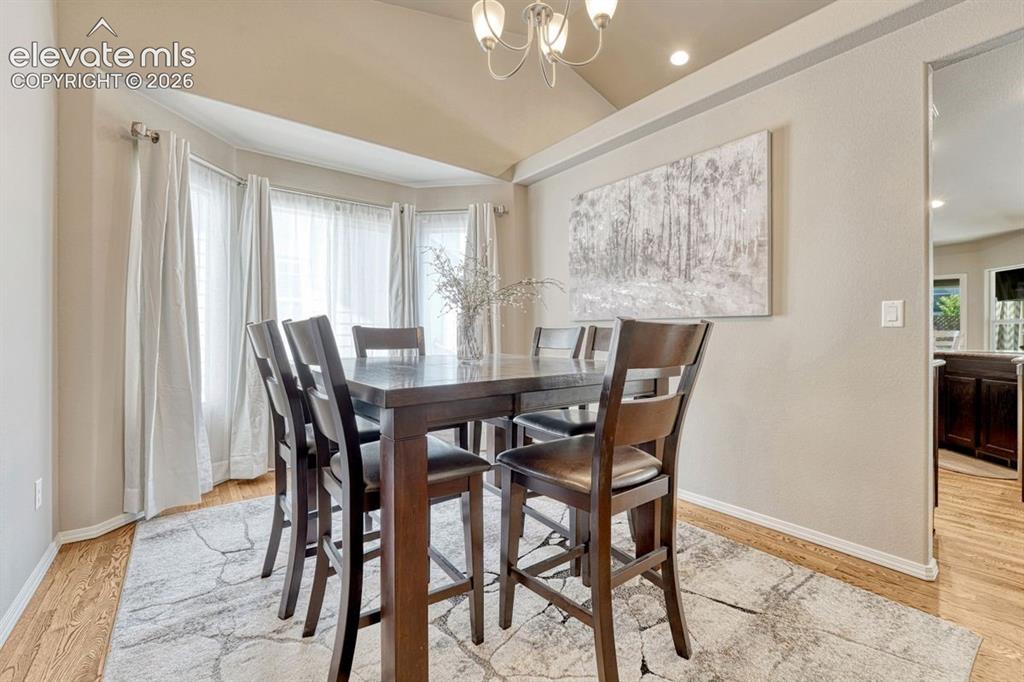 Image 19 of 50: Formal Dining Room featuring a bay window with ample natural light, a vaul