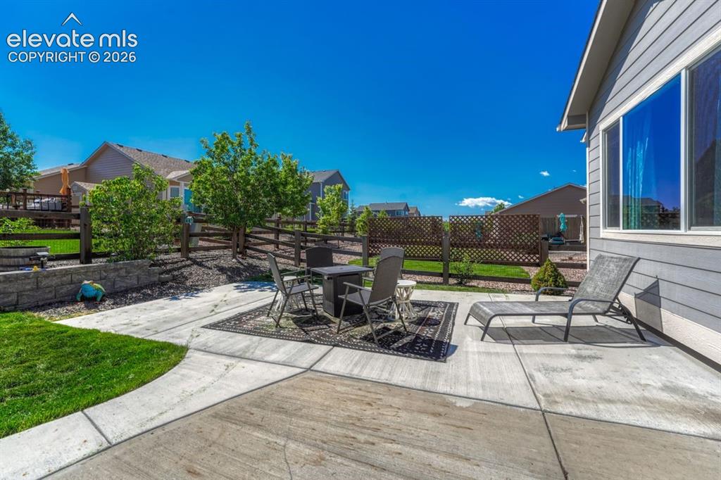 Image 44 of 50: Spacious concrete patio