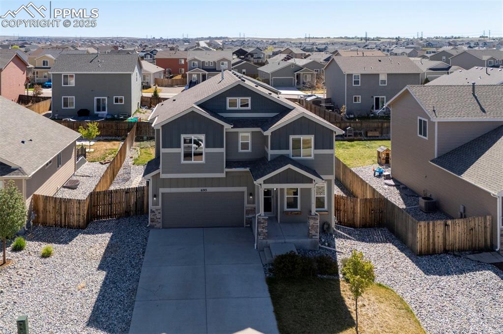 Image 3 of 50: View of front of property featuring board and batten siding, a residential 