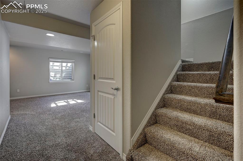 Image 38 of 50: Staircase featuring carpet flooring, recessed lighting, and baseboards