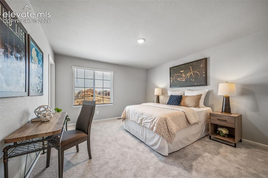 Image 4 of 21: Carpeted bedroom featuring a vaulted ceiling and recessed lighting
*Photos