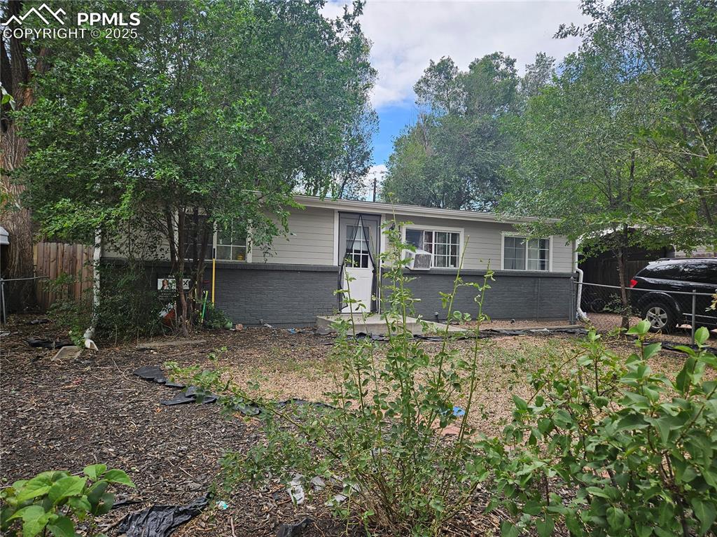 Image 2 of 23: View of front of house featuring brick siding