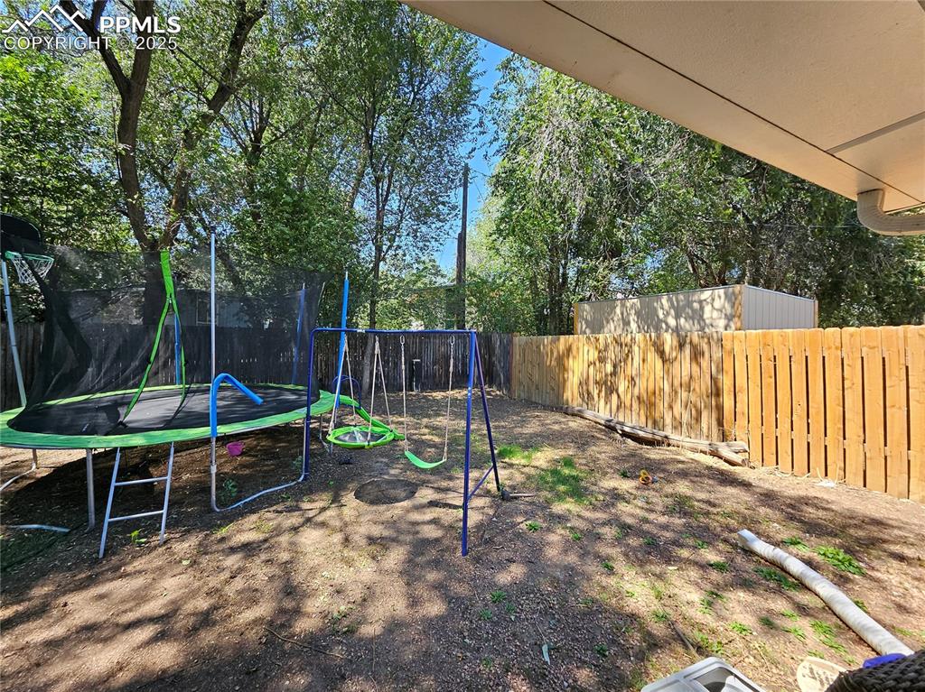 Image 20 of 23: Fenced backyard 