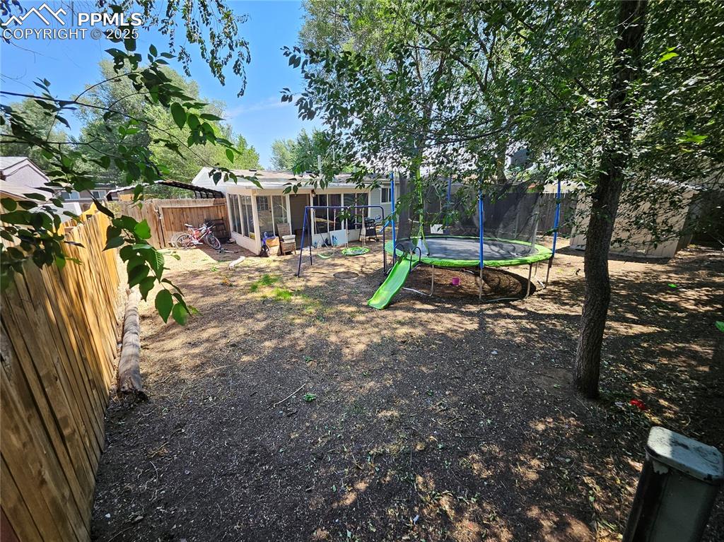 Image 21 of 23: Fenced backyard