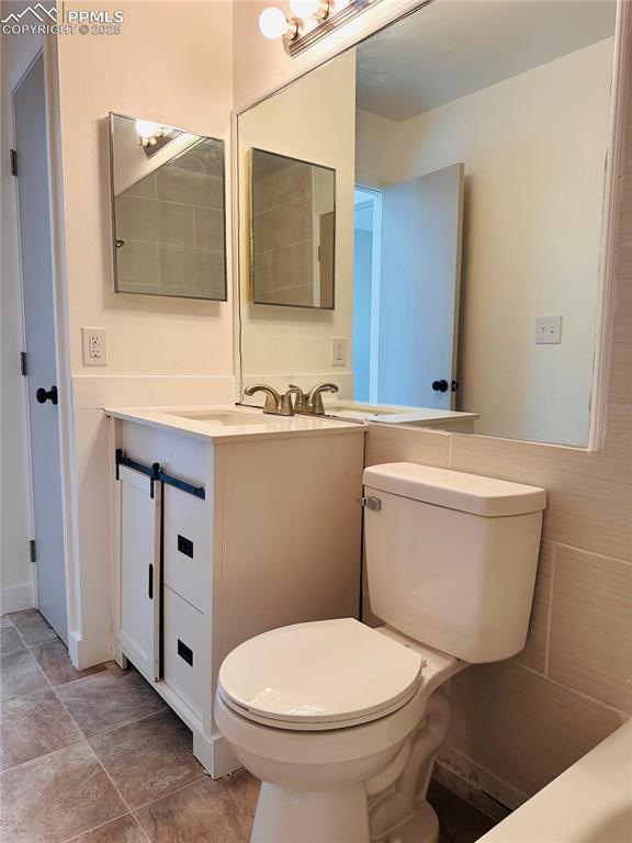Image 5 of 11: Bathroom with toilet and vanity