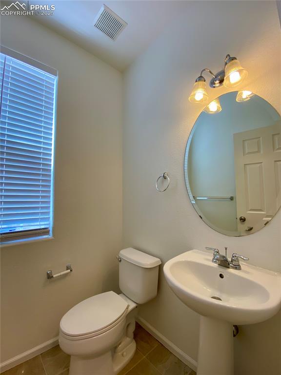 Image 12 of 38: Main level 1/2 bathroom