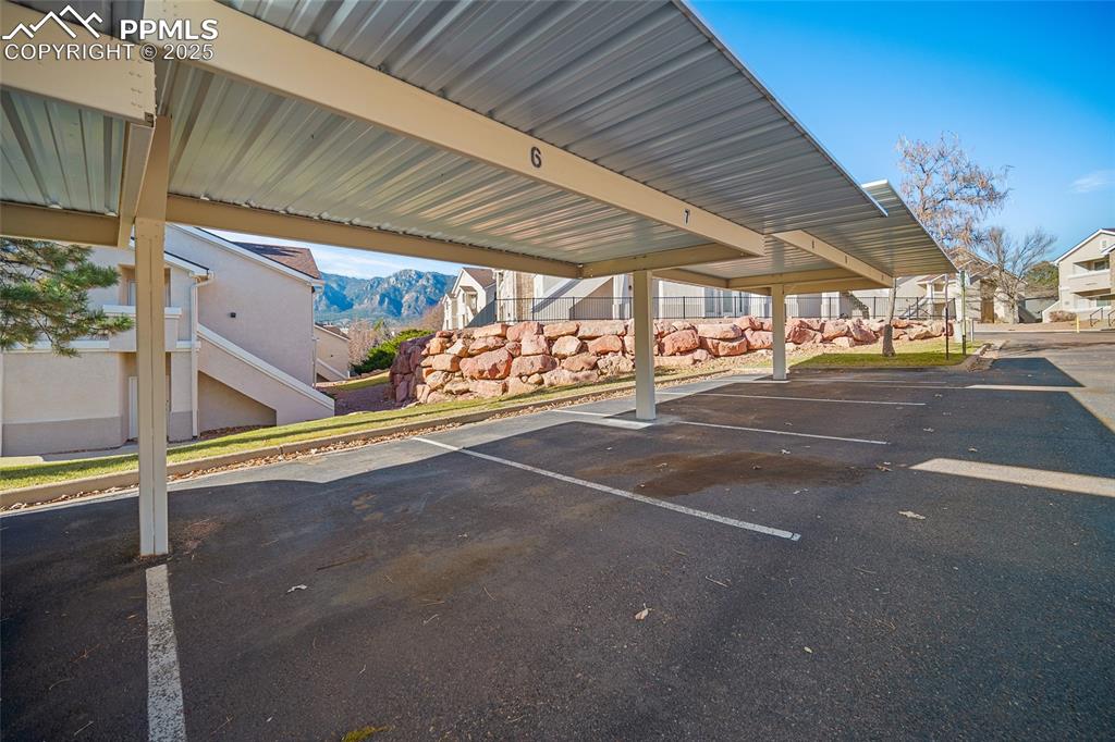 Image 24 of 31: assigned covered carport
