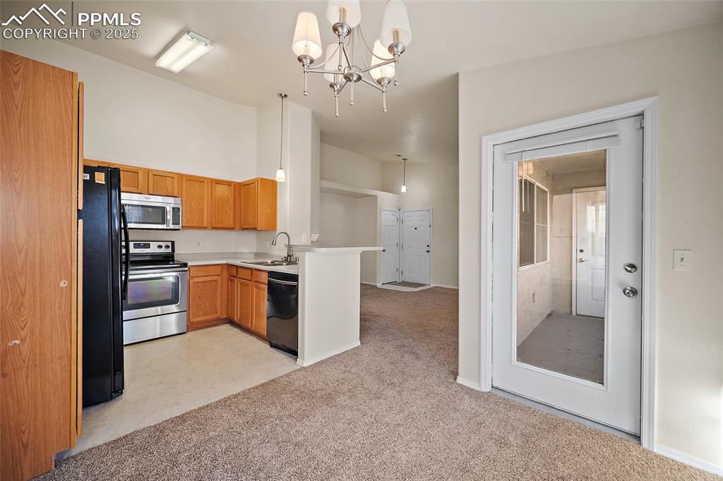 Image 8 of 31: kitchen/dining area with walk-out