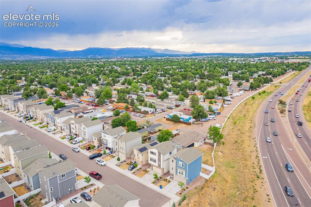 Image 15 of 46: Aerial perspective showcasing a modern residential development with a mount