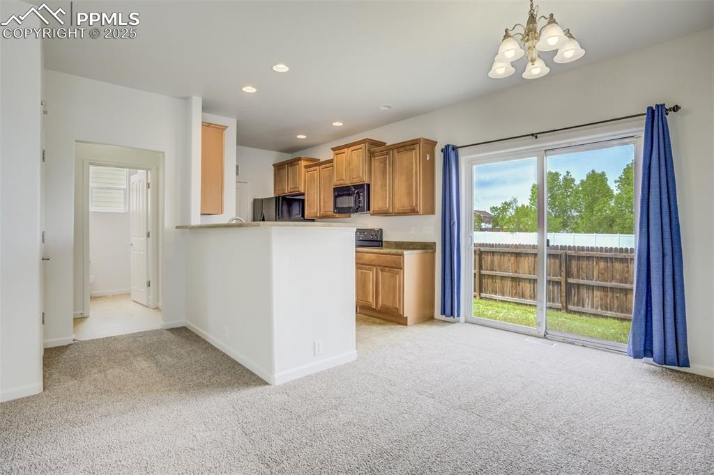 Image 15 of 50: Dining area and kitchen