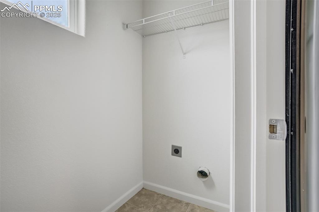 Image 21 of 50: Laundry room with hookup for an electric dryer