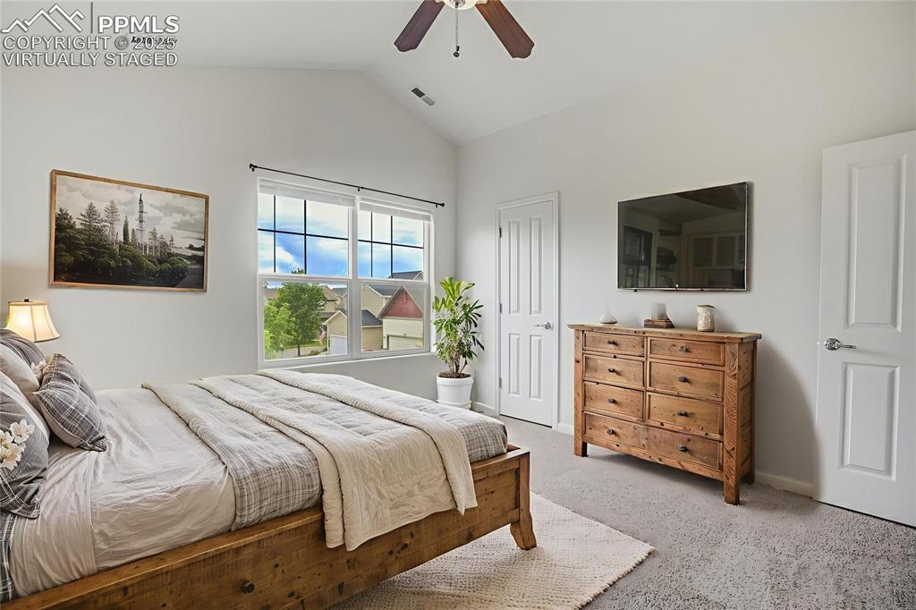 Image 26 of 50: Virtually staged bedroom with walk in closet