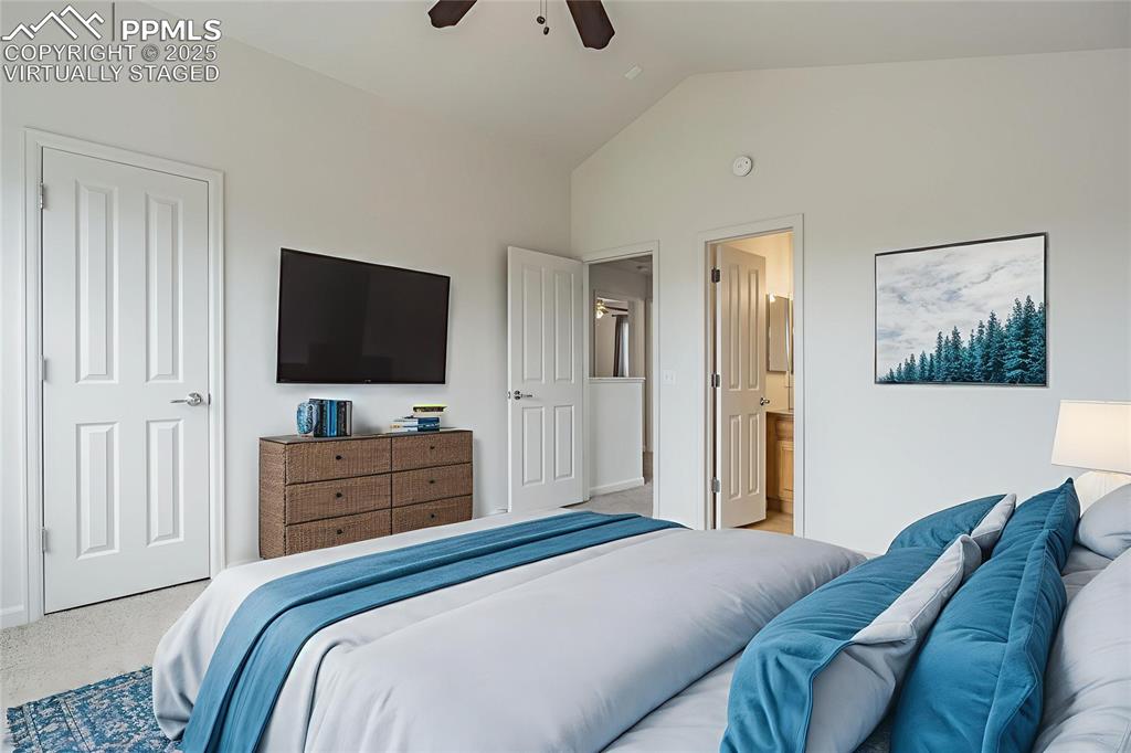 Image 28 of 50: Virtually staged primary bedroom with ensuite bathroom