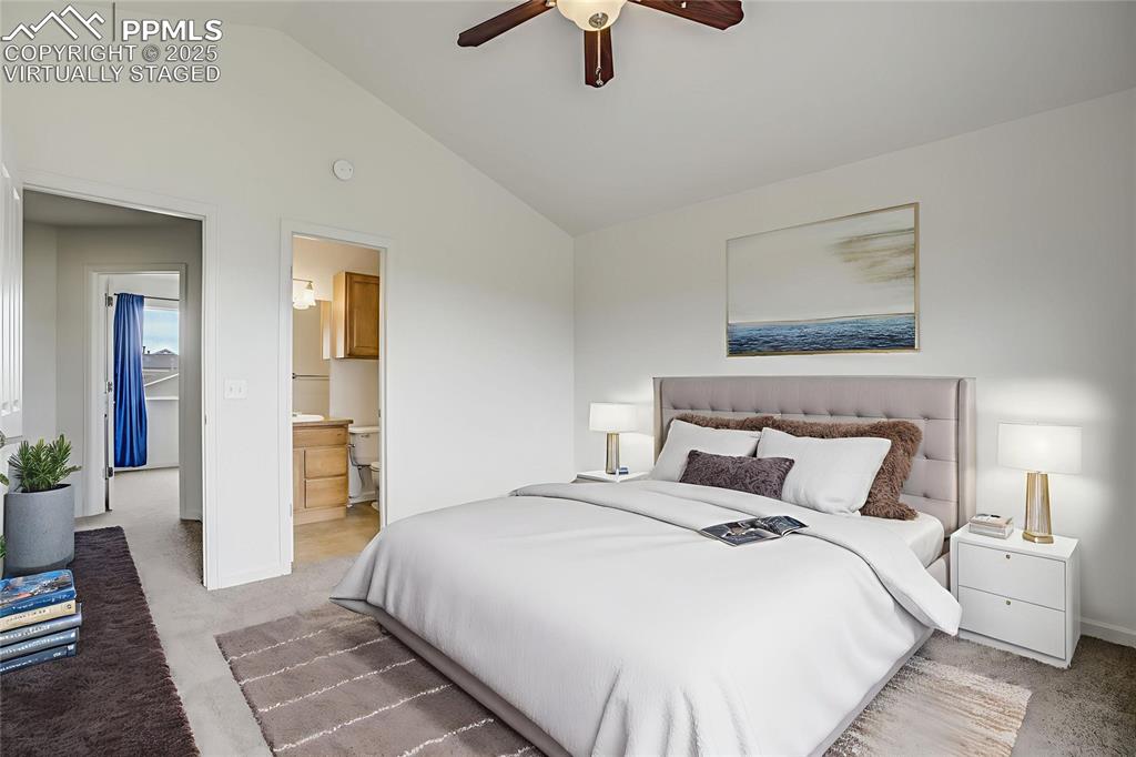 Image 30 of 50: Virtually staged primary bedroom with attached bath