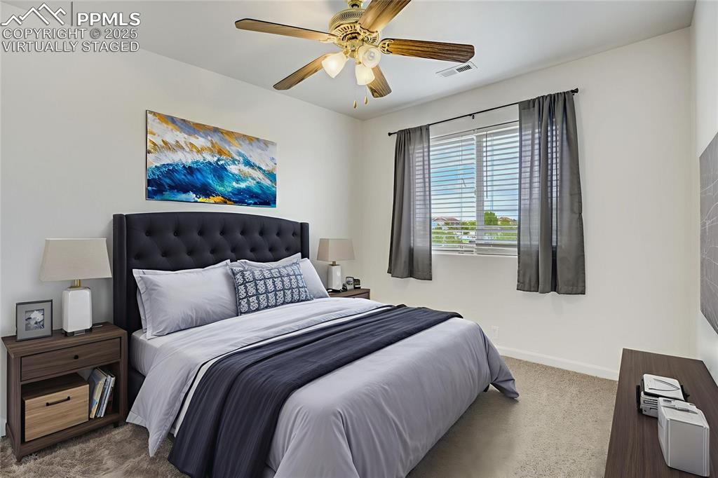 Image 33 of 50: Virtually staged bedroom #2 with ceiling fan