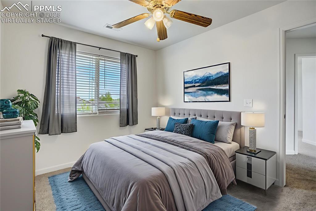 Image 35 of 50: Virtually staged bedroom #2 with ceiling fan