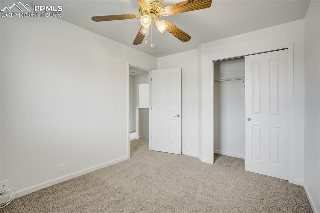 Image 38 of 50: Bedroom #2 with ceiling fan and new paint and carpet
