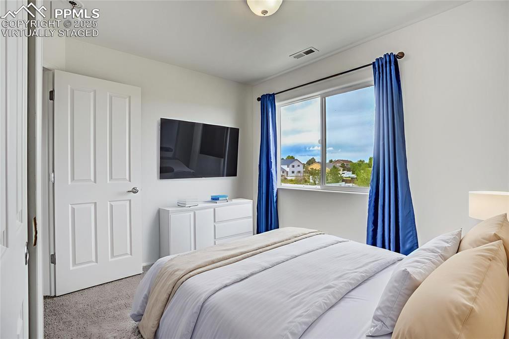Image 40 of 50: Virtually staged bedroom #3