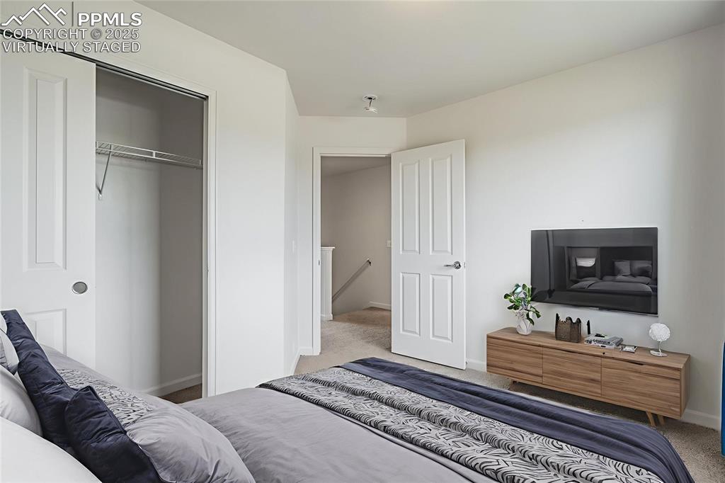 Image 42 of 50: Virtually staged bedroom #3 with large closet