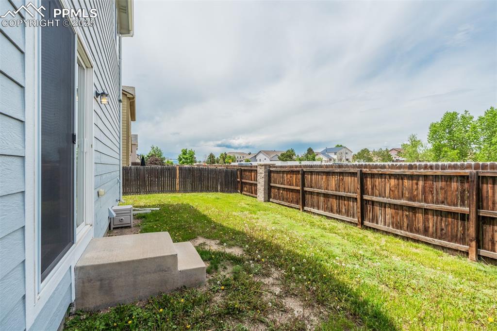 Image 46 of 50: View of fenced backyard