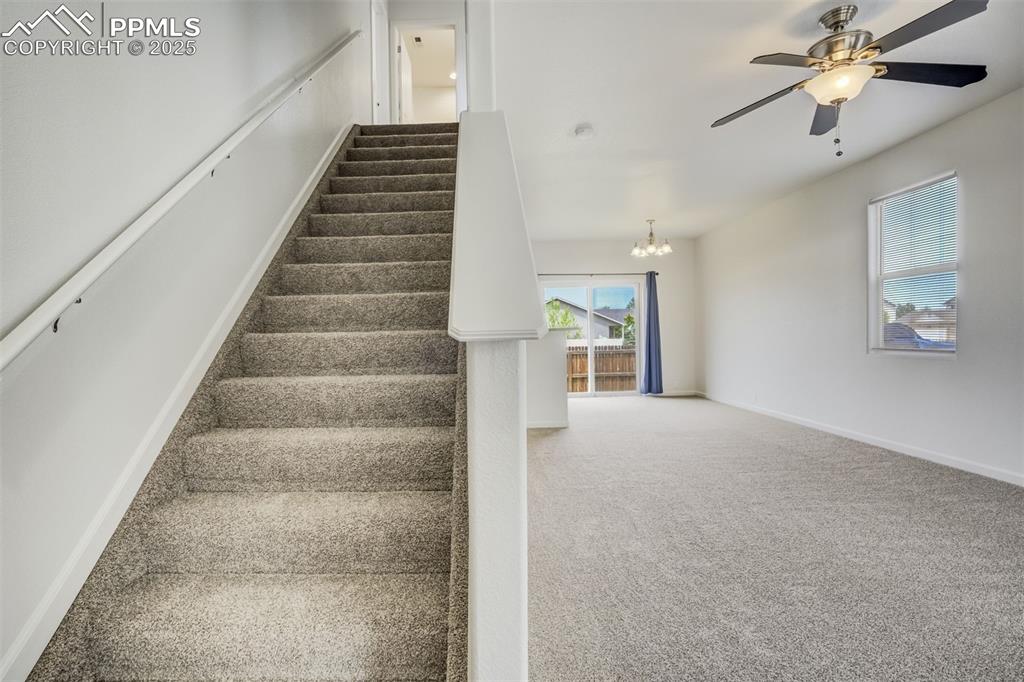 Image 5 of 50: Entry and living room and dining area