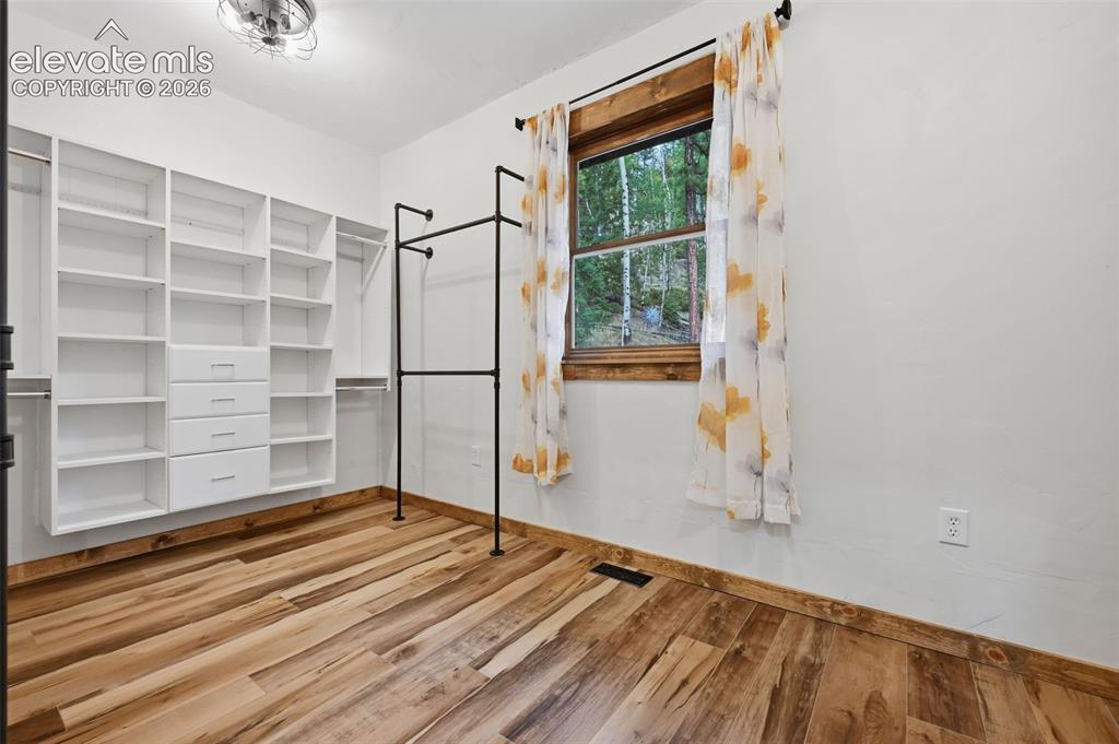 Image 18 of 33: primary walk in closet