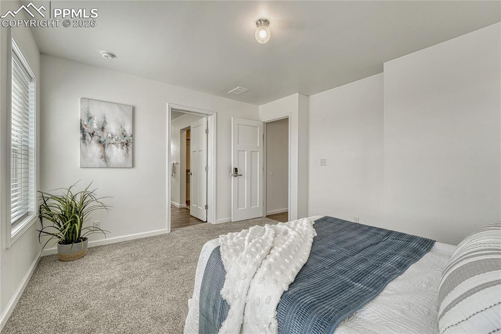 Image 24 of 48: Primary bedroom features an en-suite bathroom with walk-in closet
