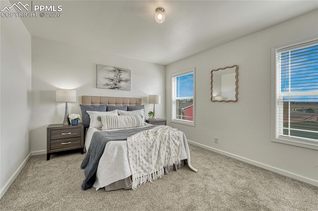 Image 25 of 48: Two great East facing windows that overlook the back yard with views above 