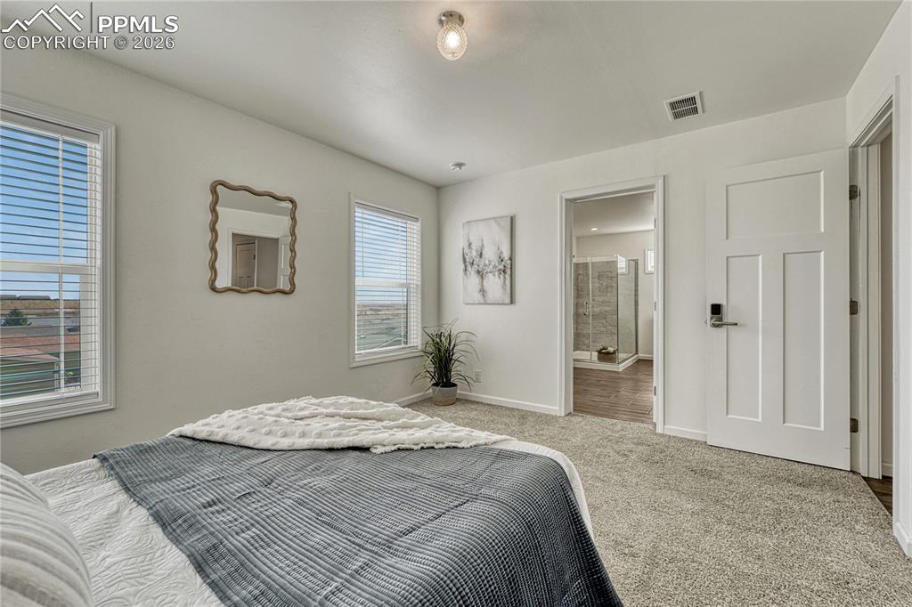 Image 26 of 48: Primary bedroom can accommodate multiple furniture configurations
