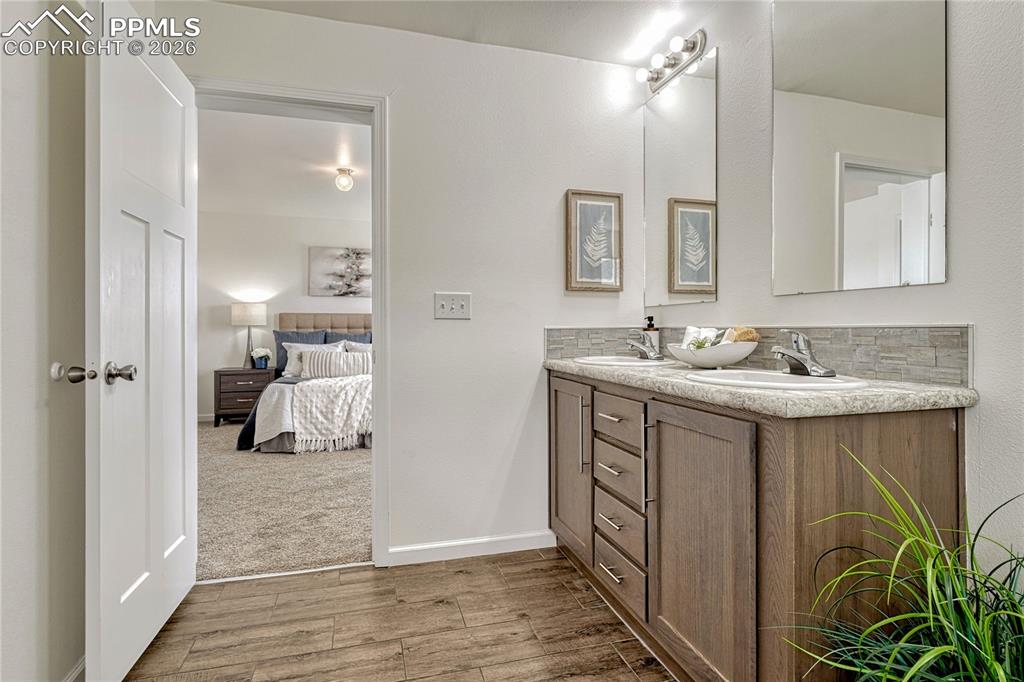 Image 29 of 48: Dual vanity cabinet has large under sink storage and individual storage dra