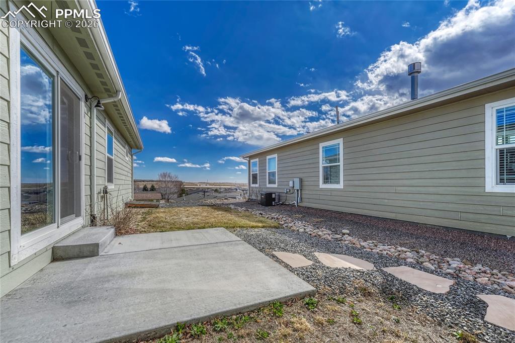 Image 34 of 48: The yard features two grass areas and views to the East, perfect for mornin