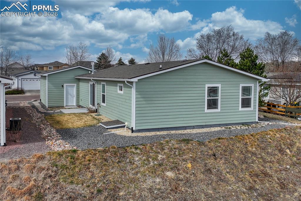 Image 35 of 48: The side yard also has access to an encapsulated, entire-home crawl space w