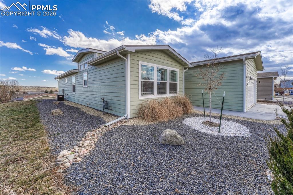 Image 38 of 48: The side and front xeriscape landscaping offers design and character with l