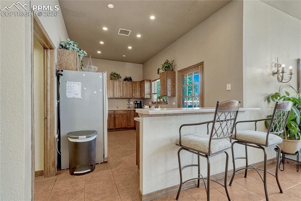 Image 44 of 48: It even has its own full kitchen and breakfast bar
