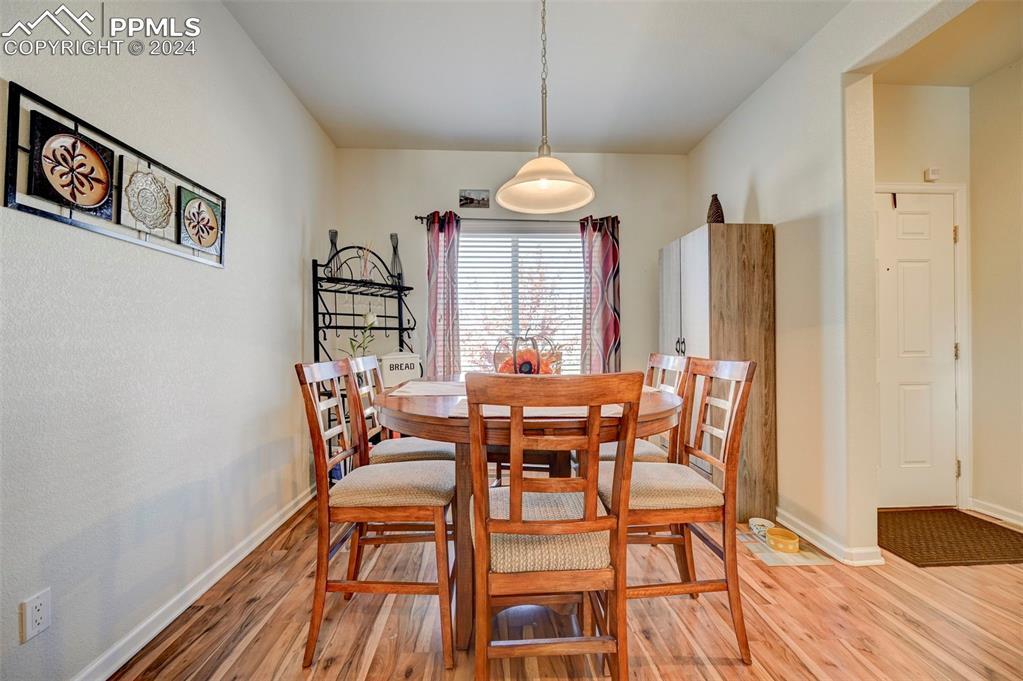 Image 13 of 45: Dining area featuring light wood-type flooring