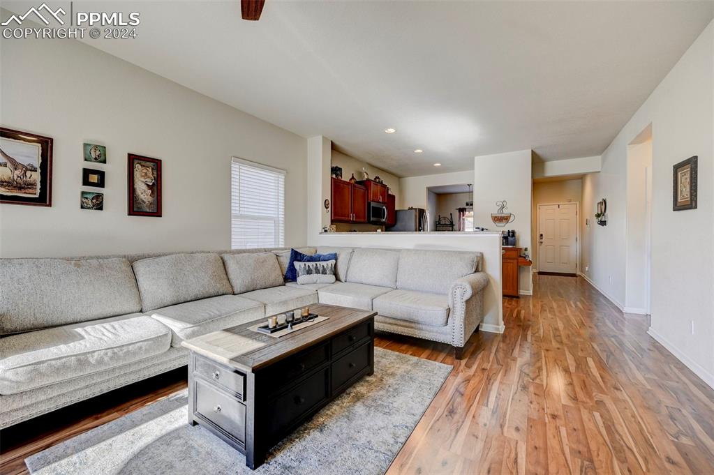 Image 7 of 45: Living room with light hardwood / wood-style flooring