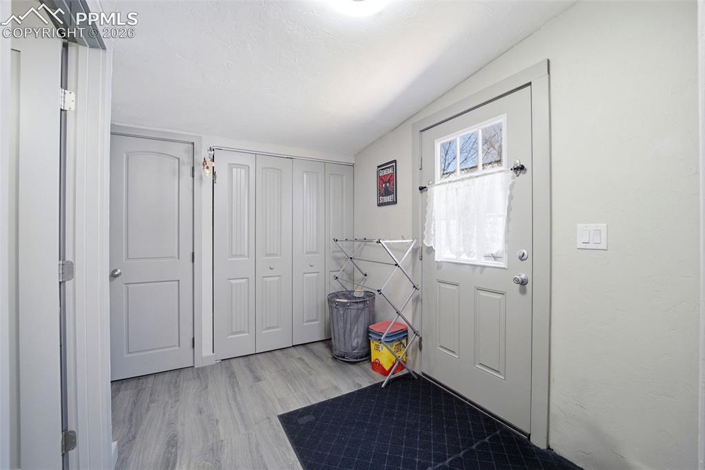 Image 13 of 35: Entry from side door - laundry behind double doors