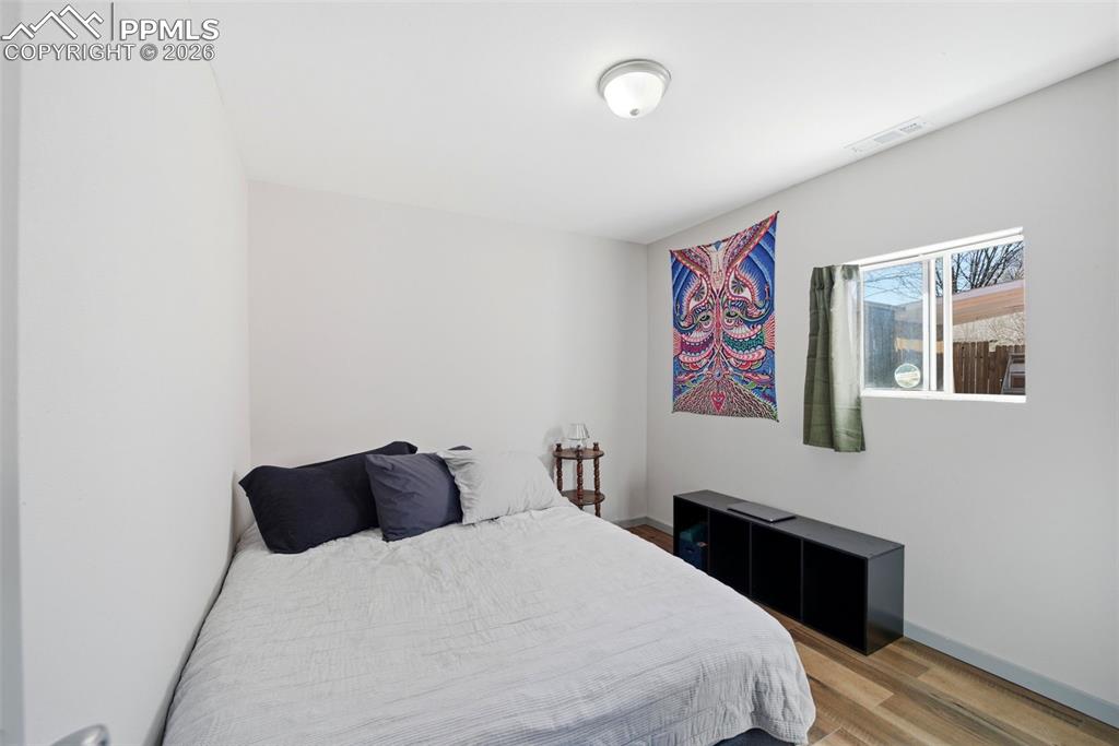 Image 25 of 35: Kitchen with stainless steel appliances, open shelves, dark cabinets, and p