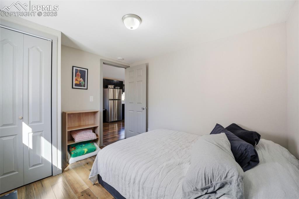 Image 26 of 35: Bedroom with LVP flooring, and a closet