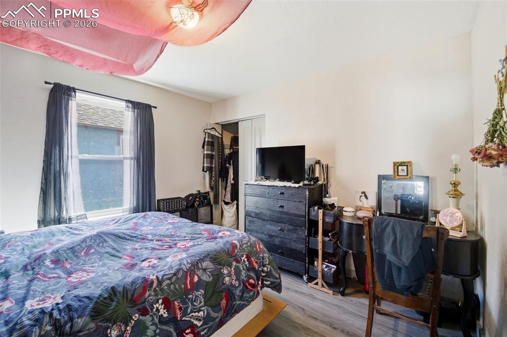 Image 8 of 35: Kitchen featuring light countertops, white cabinets, stainless steel applia