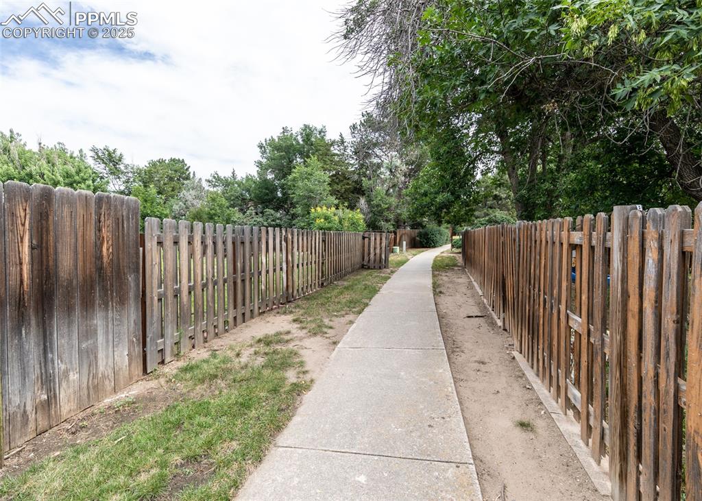 Image 22 of 22: View of trail behind home