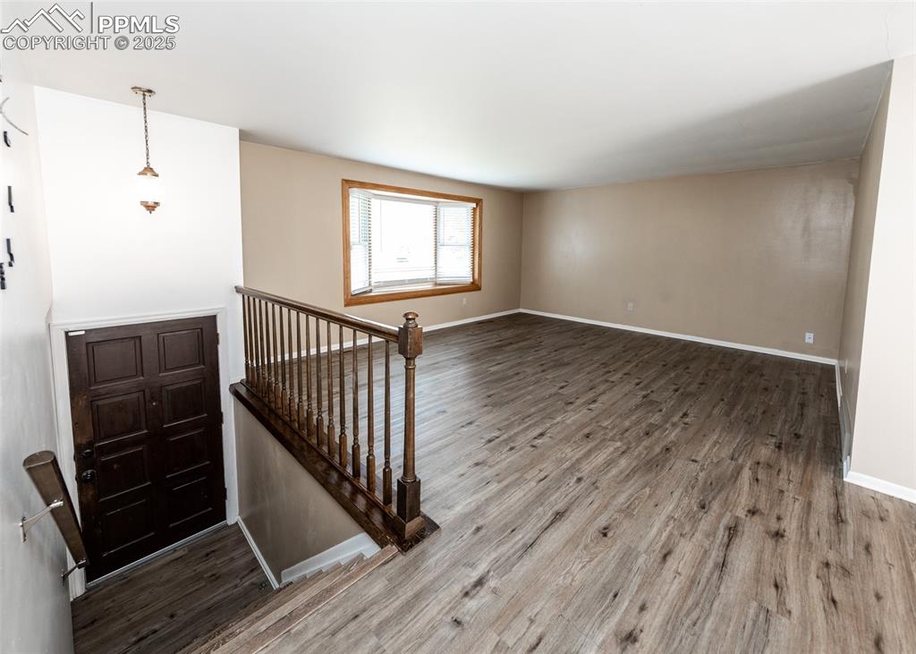 Image 3 of 22: Entry and family room