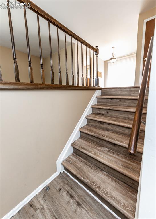 Image 4 of 22: Stairs to main level from front door entry
