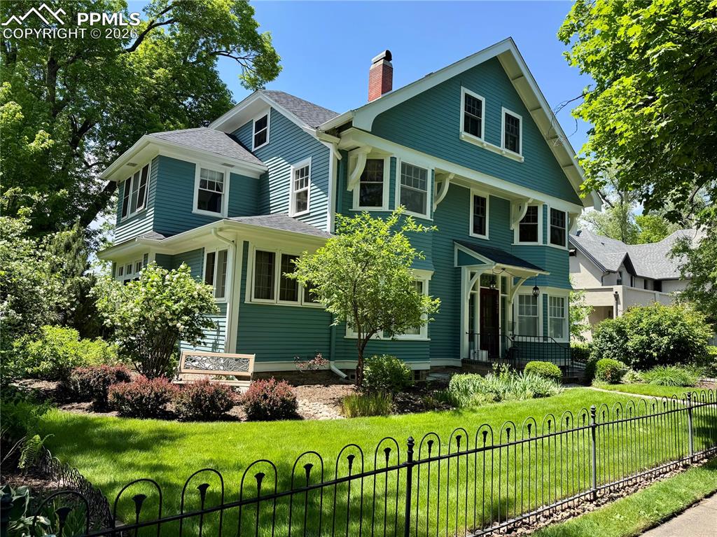 Image 1 of 49: View of front of house featuring a chimney and roof with shingles