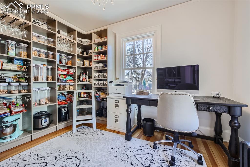 Image 13 of 49: Office space featuring light hardwood floors