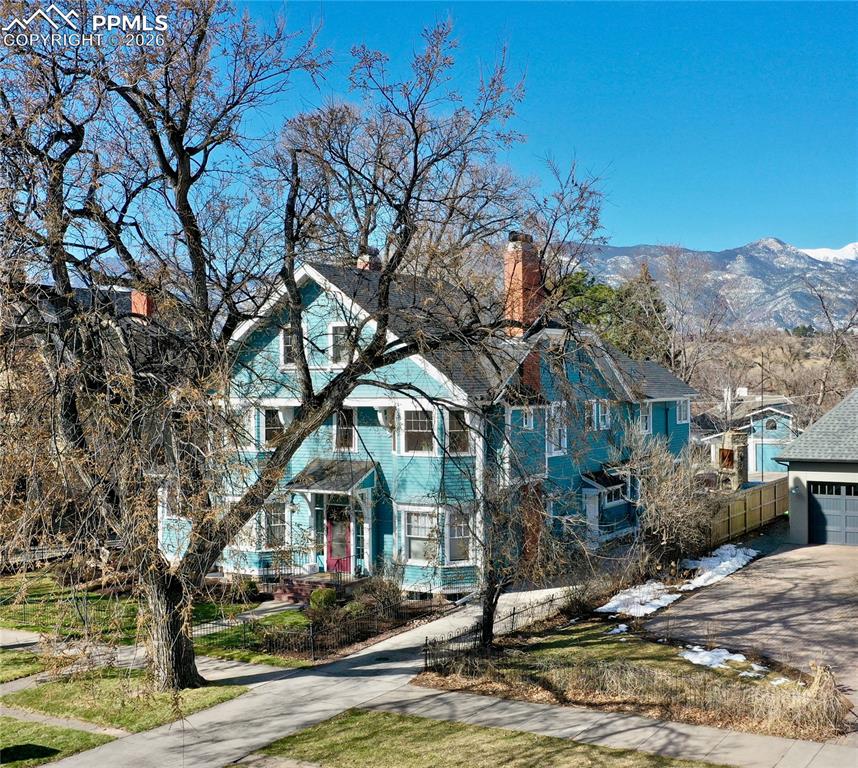 Image 2 of 49: View of front of property featuring a mountain view and a garage