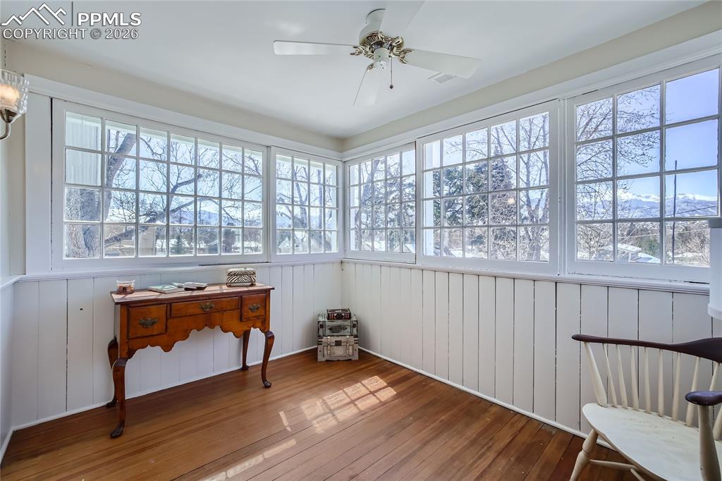 Image 40 of 49: Sunroom / solarium with ceiling fan