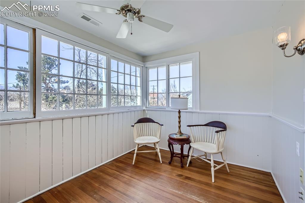 Image 41 of 49: Sunroom with ceiling fan