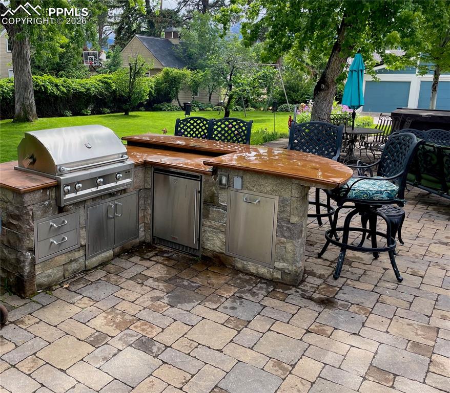 Image 7 of 49: View of outdoor kitchen 