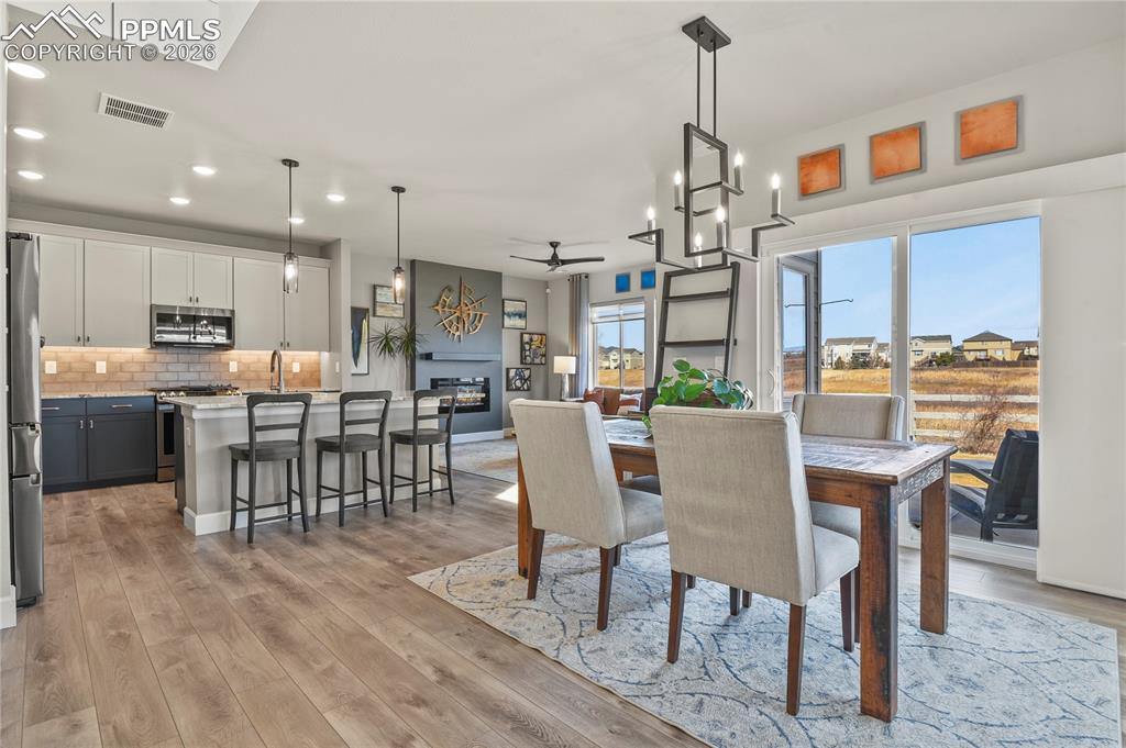 Image 3 of 27: The open-concept main level features vaulted ceilings, abundant natural lig